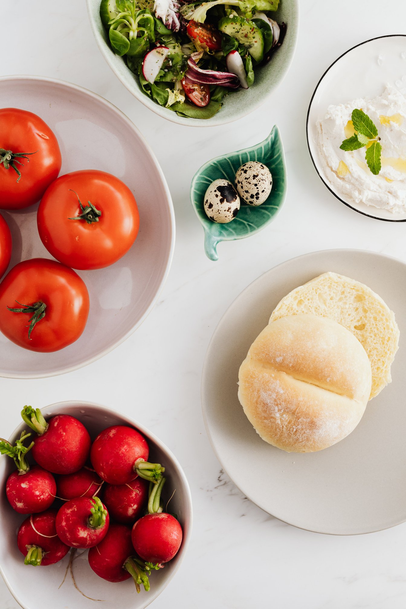 Organic vegetarian foods in bowls and on plates